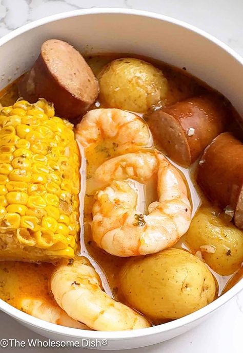 Crock Pot Shrimp Boil is a classic shrimp boil with shrimp, sausage, potatoes, and corn in a flavorful buttery broth cooked in a slow cooker. Slow Cooker Shrimp Recipes, Seafood Boil Sides, Crockpot Shrimp Boil, Shrimp Crockpot Recipes, Crockpot Shrimp Recipes, Shrimp Sausage Potatoes, Shrimp Crockpot, Crock Pot Shrimp, The Wholesome Dish