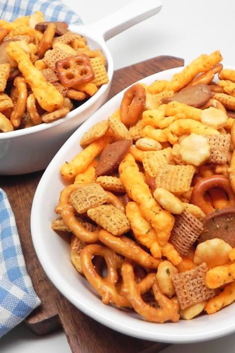 No-Bake Snack Mix | "This is my mom's no-bake snack mix recipe, and it's so much better than the normal snack mix recipes out there. It's tangy, spicy, and insanely addicting!" #footballrecipes #gamedayrecipes #tailgatingrecipes #superbowlrecipes #superbowlparty #superbowlpartyideas Snack Mix No Bake, Easy Chex Mix Recipes No Bake, Snack Mix Recipes No Bake, No Bake Chex Mix Recipes, Easy Snack Mix Recipes No Bake, No Bake Snack Mix Recipes, Toddler Snack Mix Ideas, Cracker Mix Recipes, Cheesy Snack Mix