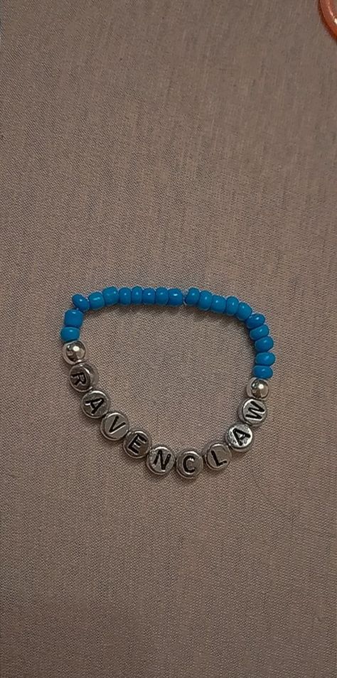 harry potter ravenclaw beaded bracelet made with blue seed beads and silver letter beads Bracelets Ideas, Harry Potter Ravenclaw, Ravenclaw, Wizarding World, Infinity Bracelet, Beaded Bracelet, Harry Potter, Beaded Bracelets, Bracelet