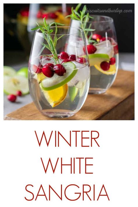 White Sangria features white cranberry juice and makes a perfectly festive lower alcohol libation. Winter White Sangria Recipe, White Winter Sangria, Winter White Sangria, White Cranberry Sangria, Beach Beverages, White Christmas Sangria, Christmas Beverages, Soup Party, Christmas Fiesta