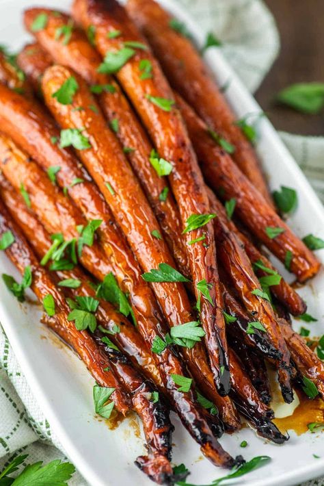 By caramelizing in a buttery and sweet maple glaze, these maple roasted carrots are simple to prepare but the perfect side dish for any meal. #mapleroastedcarrots #roastedcarrots #carrots | chiselandfork.com Carmelized Carrots, Truffle Mashed Potatoes, Maple Roasted Carrots, Maple Glazed Carrots, Roasted Carrots Recipe, Sweet Potato Fries Baked, Carrots Recipe, Bite Size Appetizers, Glazed Carrots