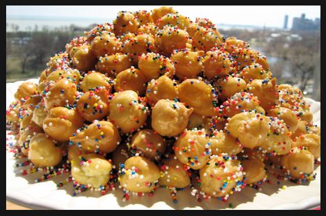 Struffoli    - 3 cups of Flour  - 1/2 tsp of Baking Powder  - 3 Eggs  - 1/2 stick of melted Butter  - Juice from 1/2 of a fresh Orange  - 1 cup of Sugar  - 1 tsp Vanilla  - Honey : 16ounce  - Crisco : 16 ounce  - Candied Sprinkles  Mix together eggs, butter, juice, sugar, and vanilla until well blended. Add flour and baking power to form soft dough. Roll ini 1/2in wide ropes. Cup into small pieces. Melt enough crisco to fry your dough. Cook until golden brown and set aside. Melt as much honey... Struffoli Recipe, Italian Christmas Cookies, Italian Bakery, Cookies Pastry, Italian Cookies, Italian Cooking, Indulgent Desserts, Italian Desserts, Noel Christmas