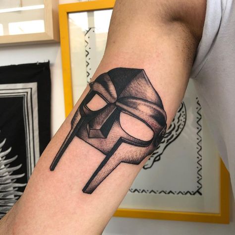 Mf Doom Tattoo Design, Mf Doom Mask Tattoo, Dr Doom Tattoo, Mf Doom Tattoo, King Geedorah, Doom Tattoo, Mf Doom Mask, Clothing Displays, Mask Tattoo