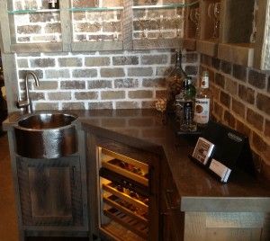 Brick wall, possibly barn wood cabinets and shelves, and I love whatever the corner with sink is made from. Corner Wet Bar, Backsplash Window, Kitchen Corner Shelves, Kitchen Cabinets And Backsplash, Faux Brick Backsplash, Basement Bar Plans, Corner Bar Cabinet, Backsplash Diy, Rustic Backsplash