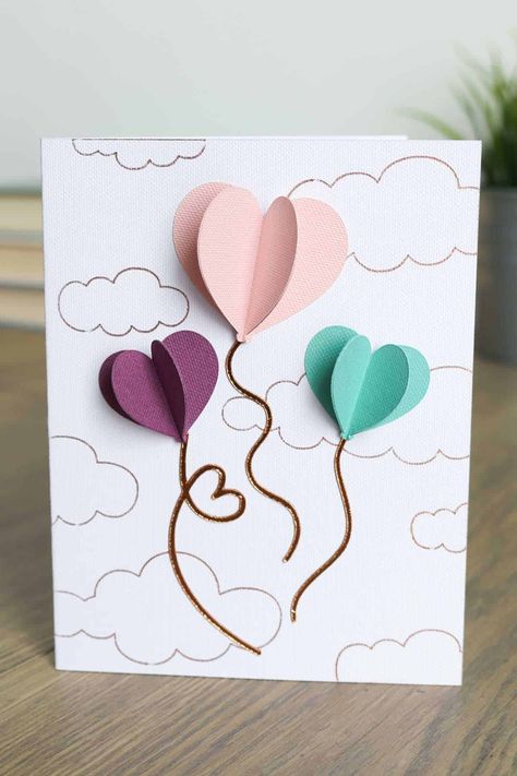 Learn how to make this 3D paper hearts paper craft card for Valentine's. Plus, foiling tips for Cricut to get the best foiled cloud background! Cricut Card Making, 3d Paper Hearts, Cricut Draw, Hearts Paper Crafts, Valentine Card Crafts, Chocolate Girl, Surprise Gifts For Him, Cloud Background, Punny Valentines