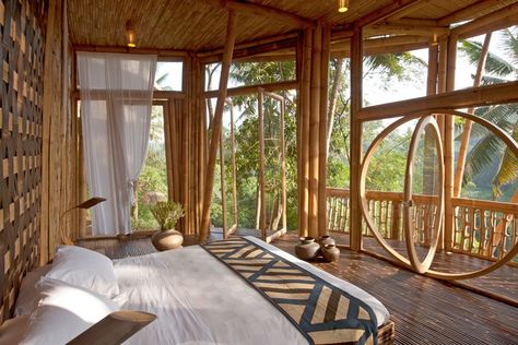 A bamboo bedroom enclosed with glass windows in Bali's Green Village Bamboo Village, Bamboo Bedroom, Magical Bedroom, Green Village, Bamboo Building, Bamboo House Design, Bamboo Architecture, Rest House, Bamboo House