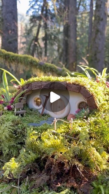 159K views · 25K likes | Maryinthefairyland on Instagram: "How about a hobbit house with a solar roof covered in living moss? How long do you think it will live? I’m very excited to see the result.  If you want your own hobbit house, I’ve created a DIY kit with all the essentials to build this house and many others. It’s available through my Etsy store: https://creatoriq.cc/49zBnBo ->Or you can find the direct link in my BIO.  Materials used: clay, recycled jar, wood rings, solar jar light, wood dowel, bark, toothpicks, hemp string, wood glue, plant coaster, soil, moss & homemade clay. Most of the products are on my Amazon storefront. ->Find the link in my BIO for more details.  If you also want to make homemade clay, I made a DIY tutorial video on YouTube: https://youtu.be/zUkbrn1gqhQ  It How To Make A Hobbit House, Crafts With Moss, Diy Hobbit House, Hobbit Terrarium, Hobit Houses, Hobbit House Kit, Garden Kaleidoscope, Hobbit Houses Diy, Fairy Garden Accessories Diy