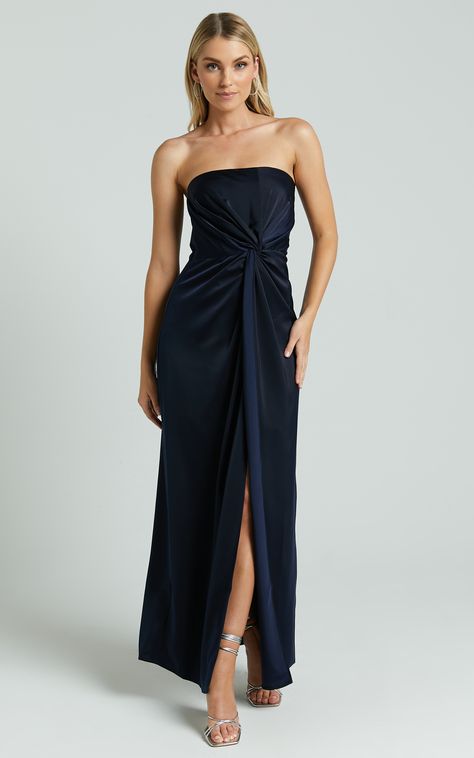 Get ready to turn heads in the Hathaway Maxi Dress - Strapless Straight Neck Twist Front Split in Navy. This stunning navy dress is perfect for any formal occasion, with its elegant design and flattering A-line silhouette. Made from high-quality polyester, this strapless maxi dress will keep you looking stylish and comfortable all night long. The twist front detail adds a touch of sophistication, while the split skirt adds a flirty and feminine touch. Whether you're attending a wedding or hittin Blue Formal Dress Long, Formal Dresses Under 100, Winter Prom Dresses, Formal Wedding Guest Attire, Navy Blue Formal Dress, Blue Formal Dress, Winter Formal Dresses, A Line Maxi Dress, Blue Bridesmaid Dress