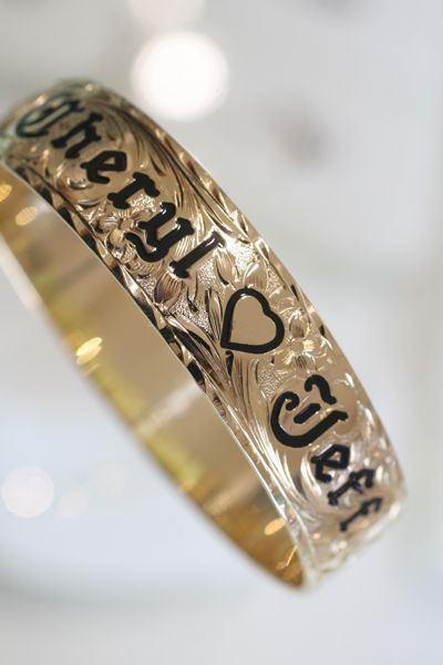 Featured: 14k yellow gold hawaiian heirloom bracelet with "Cheryl (heart) Jeff" in enameled letters over design and diamond cut border. Hand Engraved Jewelry, Hawaiian Heirloom Jewelry, Hawaiian Homes, Henry Iv, Vowel Renewal, Heirloom Jewelry, Wrist Wear, Hobbies And Interests, Engraved Jewelry