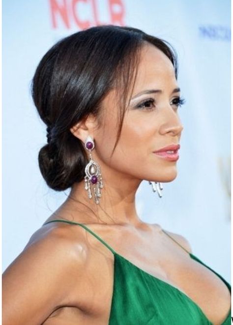 Dania Ramirez hair Step 1: Start off by applying a smoothing cream like Redken Smooth Lock Stay Sleek leave-in cream through damp hair. Then blow dry straight using either a round boar bristle brush or paddle brush, depending on your texture.  Step 2: Once hair is blown out, use the tail of a rattail comb and create a sharp center part.  Step 3: Pull your hair back (letting it cover your ears) into a low ponytail. Make sure to leave a few strands of hair out in the front for a softer look.  ... Low Haircuts, Dania Ramirez, Fashion Week Hair, It Cover, Low Chignon, Wedding Hair Up, Boar Bristle Brush, Chignon Hair, Paddle Brush