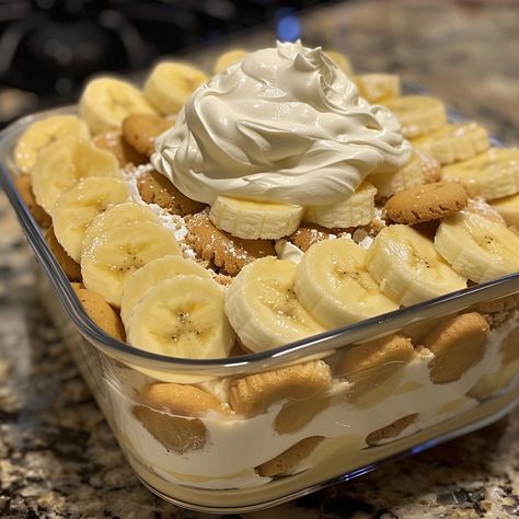 🍌 Treat yourself to creamy, dreamy Banana Pudding, a dessert that's as comforting as it is delicious! 🥄✨ 🍽️ Banana Pudding 🛒 Ingredients: Vanilla wafers: 1 box Bananas, sliced: 4 Vanilla pudding mix: 1 package Milk: 2 cups Whipped cream: 1 cup 👩‍🍳 Instructions: Prepare Pudding: Mix pudding mix with milk; whisk until thick. Layer: In a dish, layer vanilla wafers, banana slices, and pudding. Repeat. Chill: Refrigerate for at least 2 hours. Serve: Top with whipped cream before serving. 🌟 Div... Banana And Whipped Cream, Banana Pudding Aesthetic, Nutter Butter Banana Pudding, Desserts With Bananas, Classic Banana Pudding, Banana Pudding Ingredients, American Dessert, Banana Cream Pudding, Banana Slices