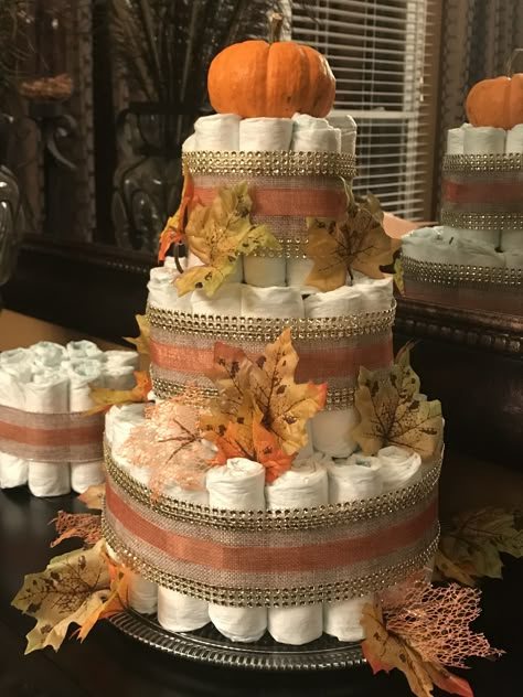 Fall Baby Shower Diaper Cakes, Diaper Cake Fall Theme, Pumpkin Diaper Cake Girl, Gender Cupcakes, Fall Baby Shower Cake, Fall Diaper Cake, Pumpkin Diaper Cake, Diaper Cake Ideas, Pumpkin Theme Baby Shower