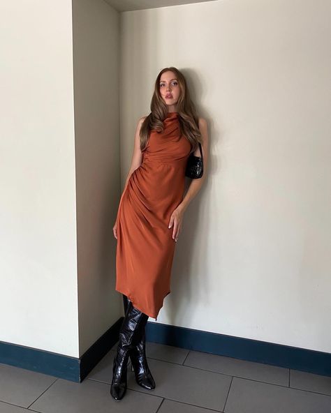 Midi dress, silk outfit, black leather boots, fall fashion, fall outfit, autumn outfit, autumn looks, burnt orange dress, leather outfit, poses for women, how to pose, long silk dress, high leather boots; fashion inspo, outfit ideas for fall, outfit ideas for women, classy outfits, classy fashion, minimal style, fall outfit trends, sophisticated outfits, sophisticated style, modest fashion, modest outfit ideas, what to wear in fall, trending outfits, style ideas, pretty dresses, fancy dress, Long Silk Dress Outfit, Women Classy Outfits, Outfits Sophisticated, Silk Dress Outfit, What To Wear In Fall, Fall Outfit Trends, Midi Dress Silk, Fall Outfit Ideas For Women, Silk Dresses Outfit