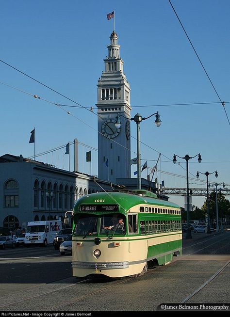 MUNI car 1051 heads west along the Embarcadero at the Ferry Building in San Francisco. This PCC streetcar was built by St. Louis Car Co. in 1948, and is painted to honor the San Francisco Municipal Railway (with the simplified 1960s livery).: San Francisco Photography, San Francisco Photos, Visit San Francisco, San Francisco City, San Francisco Travel, San Fran, California Dreaming, Street Cars, San Francisco Bay