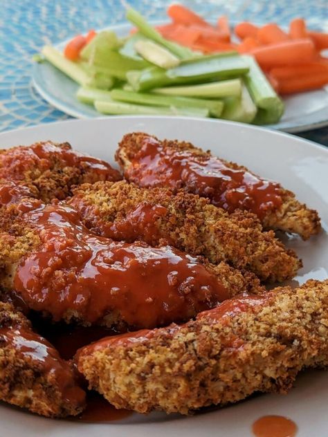 A plate of buffalo chicken tenders. Buffalo Chicken Tenders Air Fryer, Air Fryer Buffalo Chicken Tenders, Chicken Tenders Air Fryer, Brisket Sliders, Buffalo Chicken Strips, Air Fryer Buffalo Chicken, Vinegar Coleslaw, Horseradish Cream Sauce, Frozen Sweet Potato Fries