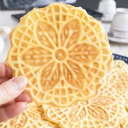 Almond Pizzelle Cookies - These Italian waffle cookies are light, crispy & delicious! A festive dessert, breakfast or snack. #pizzellecookies #pizzellerecipe Cinnamon Pizzelle Recipe, Pizzelle Cookies, Pizzelle Recipe, Dessert Breakfast, Waffle Cookies, Festive Desserts, Dessert Tray, Cookie Tins, Italian Cookies