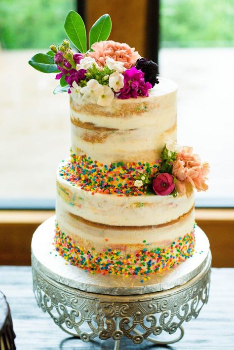 Fun and unexpected wedding cake full of color - Rainbow sprinkles and flowers wedding cake - naked cake  #mckinneyweddingplanner #mckinneywedding #mckinneyweddings #weddingplanner #weddingplanning #weddingdetails #funweddingcake #funfettiweddingcake Funfetti Wedding Cake, Sprinkle Wedding Cakes, Rainbow Wedding Cake, Glitter Wedding Cake, Chandelier Cake Stand, Wedding Cakes Flowers, Floral Wedding Theme, Rainbow Forest