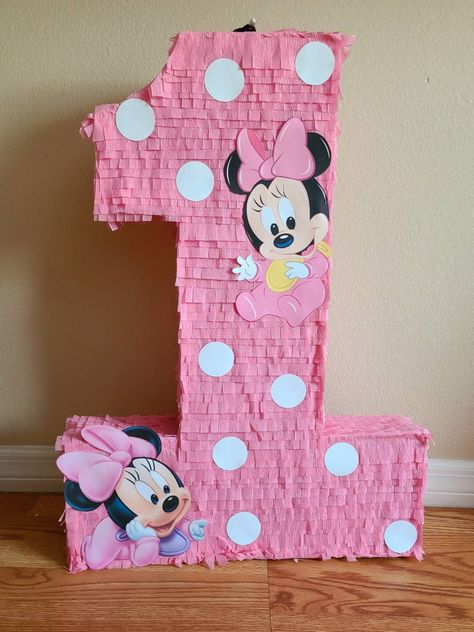 "Beatiful number piñata with minnie mouse theme. It can be customizable whit the color or character you need Minnie - mickey -Donald -Daysi- Pluto or any other characters The sizes can be 24\" 36\" The piñata supports 3-5 of candies. Candies are not including in the price only the piñata.this piñata is breakable If you need also the matching piñata stick or a pull string piñata please let me know and i can make a custom order for you. Let me know the exact date of the party for make sure it arri Pinata Mickey Mouse, Minnie Mouse Piñata Pink And Gold, Minnie Mouse Balloon Mosaic, Minnie Mouse Pinata, Pinata Stick, Minnie’s Bowtique Centerpieces, Birthday Pinata, Mickey Mouse First Birthday, Piñata Ideas