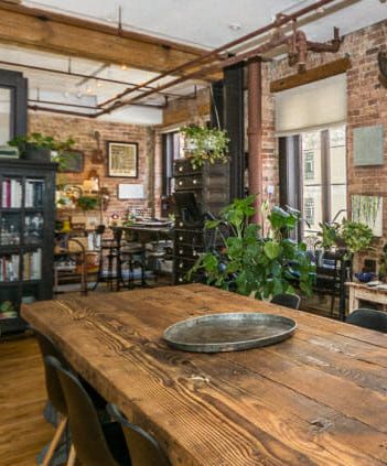 Dining Table Reclaimed Wood, Loft Seating Area, Brick Loft Apartment, Artist Loft Apartment, Chicago Loft Apartment, Wood Dining Table Design, Brick Dining Room, Loft Dining Table, Loft Kitchens