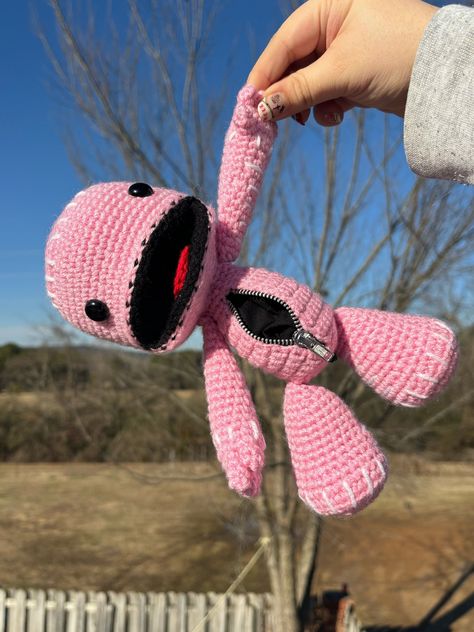 This is a finished crochet amigurumi Sackboy-inspired doll! Created using the softest, most vibrant yarns! This crochet doll features a hand-sewn fully functional zipper pocket in the belly! Dimensions: 14in x 7in x 6in  (36cm x 18cm x 15cm) Custom Listing? Message me for more information! Pattern Credits: Emvycreates.#KnitToys #KnitDolls #HandmadeToys #DIYToys #KnitCrafts #ToyKnitting #DollKnitting #KnitLove #KnitFun #KnitInspiration Crochet Pillow Thick Yarn, Crochet Eyelids, Gravity Falls Crochet Pattern Free, Crochet Cute Things Easy, Alt Crochet Plushies, Fun Stuff To Crochet, Cursed Crochet Projects, Minecraft Crochet Patterns Free Amigurumi, Small Crochet Doll