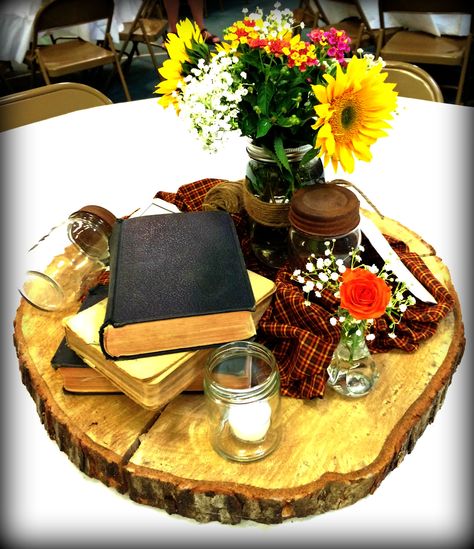 Rustic Bible centerpiece Mission Conference Centerpieces, Pastor Appreciation Table Centerpieces, Bible Table Decorations Ideas, Ladies Banquet Table Decor, Fundraiser Dinner Centerpieces, Bible Table Decorations, Pastor Appreciation Banquet Ideas, Centerpieces For Church Events, Pastor Appreciation Dinner Ideas