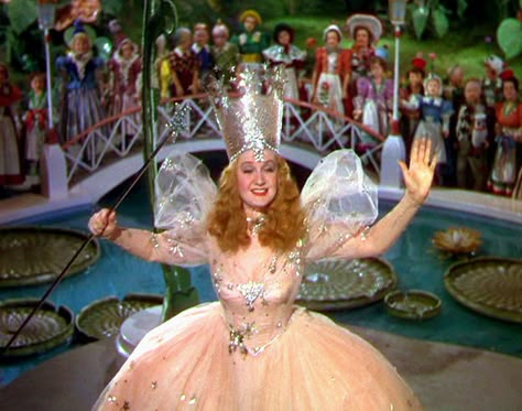 10 Best Gold Hair and Makeup Moments In Movies | Vogue Glenda The Good Witch, Billie Burke, It Happened One Night, Wizard Of Oz 1939, Glinda The Good, Glinda The Good Witch, The Wonderful Wizard Of Oz, The Wizard Of Oz, The Good Witch