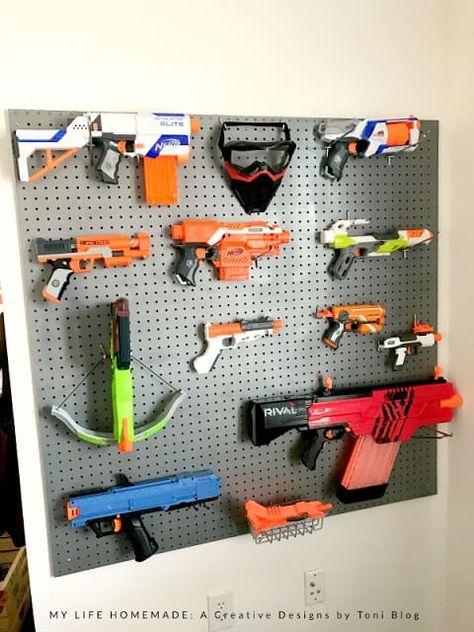 pegboard Nerf gun storage Nerf Wall, Nerf Storage, Remodel Garage, Boys Bedroom Storage, Army Bedroom, Spa Bedroom, Bedroom Storage Ideas, Kids Bedroom Storage, Diy Toy Storage