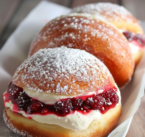 These fluffy doughnuts are filled with a luscious raspberry cream and dusted with powdered sugar for a perfect treat.... https://northeastnosh.com/doughnut-stuffed-with-raspberry-cream/ #northeastnosh #doughnut #donut #raspberry #cream #stuffeddoughnuts #creamdougnuts #food #foodie Lemon Cake Bars, Cream Filled Donuts, Chicken Gnocchi Soup Recipe, Air Fryer Recipes Dessert, Microwave Fudge, Coconut Cheesecake, Fried Ice Cream, Raspberry Cream, Filled Donuts