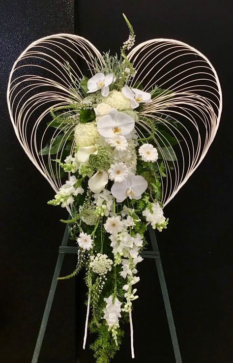 Modern Heart-Shaped Sympathy Standing Spray Kui & I Florist, LLC Hilo, Hawaii kuiandiflorist.com #kuiandi #florist #kuiandiflorist #hilo #hawaii #luckyweliveHawaii #bigisland #tropical #flower #flowers #hawaiianflorist #sympathy #sympathyflowers #standingspray #heart Condolences Flower Arrangement, Unique Sympathy Floral Arrangements, Heart Shape Flower Arrangement, Flower Arrangements For Church, Unique Casket Sprays For Men, Heart Sympathy Arrangements, Heart Casket Sprays, Standing Spray, Sympathy Floral