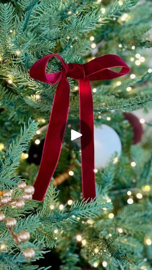 631 reactions · 61 shares | Create affordable and gorgeous velvet ribbon bows for your Christmas tree to add extra holiday magic. Comment BOW and I will message you the ribbon I used. 

I love that these bows can be made affordably and you can customize the color and size to fit your holiday aesthetic. I used a spool of burgundy velvet ribbon from Amazon and was able to make about 25 bows, each strand was about 30-36 inches in length. Add ornament hangers to the back of the bows and attach them to the tree. | Ashley Hoglan | Outfit Ideas & Lifestyle Bow Ideas For Christmas Tree, Velvet Bows On Christmas Tree Diy, Christmas Tree With Bows Ribbons, How To Tie A Velvet Ribbon Bow, Christmas Tree With Red Bows, Velvet Bows On Christmas Tree, Velvet Ribbon Christmas Tree, Bows On Christmas Tree, Christmas Tree With Bows