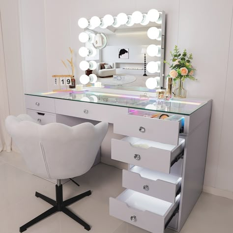 l Makeup vanity desk with 13 storage drawers：The 13 drawers have a large capacity, so you can easily put your cosmetics into the drawers of the vanity table. l Build-in RGB LED light strip：By tapping the metal button on the left side of the table, the… Vanity Mirror Table, Makup Desk, Ikea Vanity Ideas Bedroom, Vanity Ideas Bedroom Aesthetic, Room Ideas Vanity, Vanity Set Up Ideas, Dresser Design Ideas, Makeup Desk Ideas, Vanity Desks