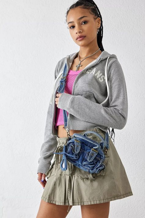 Add denim to your accessories with this mini duffle bag by BDG. Crossbody bag Ft. a zip-up fastener, a removable denim strap, utility pockets and gold-tone hardware. Complete with a heart-shaped mirror attachment. UO exclusive. Dystopian Outfits, Iconic Fashion Moments, Mini Duffle Bag, Early 2000s Style, Versatile Clothing, 2000s Style, Utility Pockets, 2000s Fashion Outfits, Fashion Moments