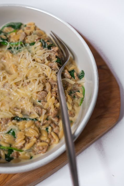 Italian Sausage Orzo Creamy orzo dish One-pot pasta meal Hearty dinner recipe Sausage and spinach orzo Italian Sausage Orzo Pasta, Sausage And Orzo Recipe, Italian Orzo Pasta, Orzo Sausage, Orzo Creamy, Italian Sausage Orzo, Sausage And Orzo, Sausage Orzo, Cheesy Orzo