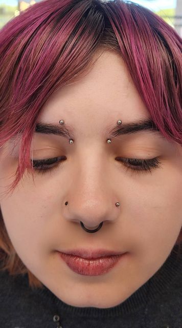 Baron Art Piercing Studio on Instagram: "Bridge piercings are one of the most turned down piercings.  You have to have enough tissue to hold the barbell without the tissue being manipulated a certain type of way.  Bridge piercings are also done with a straight barbell. Curved barbells are not acceptable and can cause more scarring and a "cheese cuttet" effect.  This is a great alternative to a bridge. You would need to have the right anatomy for it and be diligent with aftercare to ensure a happy, long-lasting piercing. As with any piercings, you still run the risk of migration or rejection of snagged hard.  Piercer: @piercing.mistress  . . . #pairedinnereyebrowpiercing #piercing #nostril #orangepiercer #innereyebrowpiercing #eyebrowpiercing #nostril #piercingvideo #explorepage" High Bridge Piercing, Triple Bridge Piercing, Eyebrow Piercing Placement Chart, Eyebrow Piercing And Glasses, Inner Eyebrow Piercing, Bridge And Septum Piercing, Vertical Bridge Piercing, Double Bridge Piercing, Bridge Piercing With Glasses