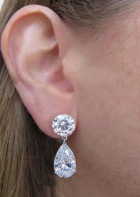 Sensational Vivid Diamonds Dangle earrings crafted in platinum showcasing 2 GIA certified round brilliant cut diamonds weighing 6.05 carats total, G-H color, VS1-SI1 clarity and 2 GIA Certified pear shape diamonds weighing 8.75 carats total, G-H color, VS clarity. The pear shape diamonds dangle from round brilliant cut diamonds, dancing with movement in a spectacular display of brilliance and fire. These stunning earrings measure 1 inch in length and .34 of an inch at their widest part. They hav Dangle Diamond Earrings, Diamond Dangle Earrings, Earring Crafts, Pear Shaped Diamond, Stunning Earrings, Round Brilliant Cut Diamond, Round Brilliant Cut, Pear Shape, Pear Shaped