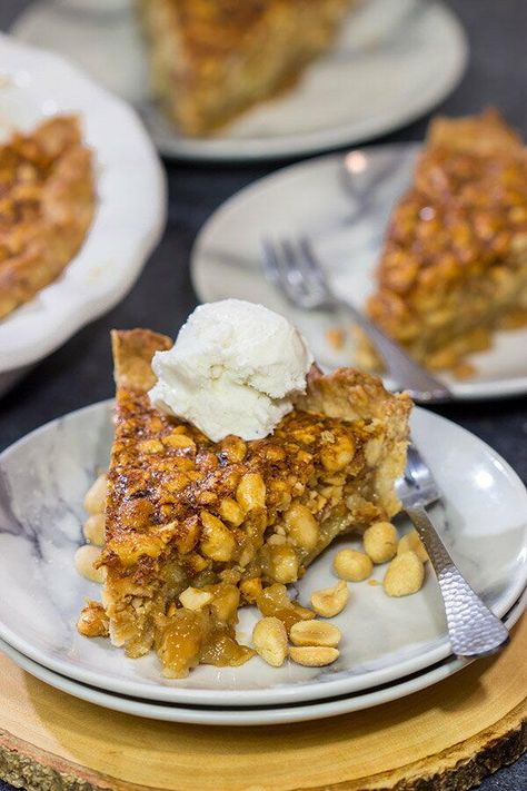 Growing up in the Carolinas, I heard about peanut pie, but I can’t say I ever tried a slice.  However, I’m making up for lost time now!  Holy peanuts, Batman – Virginia Peanut Pie is delicious!  Laura walked through the kitchen as we were prepping to make this Virginia Peanut Pie, and she was like what is that?  I told her it was the state pie of Virginia.  Laura took one bite and immediately proclaimed, “Why do we make pecan pie at Thanksgiving!?  We should make peanut pie instead!”  She’s righ Easy Recipes Desserts, Chocolate Fudge Pie, Peanut Pie, Salty Desserts, Fudge Pie, Pumpkin Pie Bars, Winter Cooking, Tasty Dessert, The Carolinas