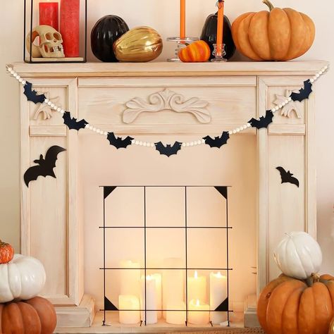 How adorable is this bat garland!? This is a must have for your Halloween decor.

About this item
🦇Super Cute Design: The garland is made of felt bats with wooden beads as spacers
🦇Material: Round beads are made of premium wood, black bats are made of felt
🦇Easy to Hang: Ropes on both ends are specially designed for easy hanging
🦇Fit For: Great addition for fireplace mantle, wall and room decoration
🦇Dimensions: About 5' when hanging. See photo. Felt Bats, Bat Garland, Halloween Mantle Decor, Halloween Fireplace, Bat Decorations, Cute Halloween Decorations, Halloween Mantle, House Shelves, Rustic Halloween