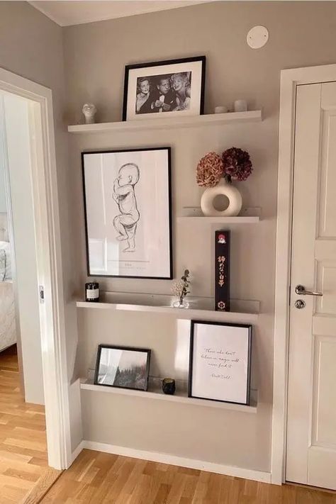 Picture Ledge Corner, Staggered Picture Shelves, Picture Shelf Entryway, Floating Shelf Picture Wall, Picture Wall Ideas With Shelves, Picture Shelves Ideas, Accent Wall With Picture Ledge, Photo Ledge Ideas, Gallery Wall With Picture Ledges