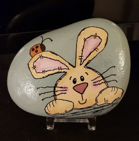 Bunny Rocks Painted Stones, Rabbit Rock Painting Ideas, Easter Bunny Rock Painting, Rabbit Painted Rocks, Bunny Rock Painting, Easter Rock Painting Ideas, Painted Rock Cactus, Terra Cotta Pot Crafts Diy, Easter Paintings