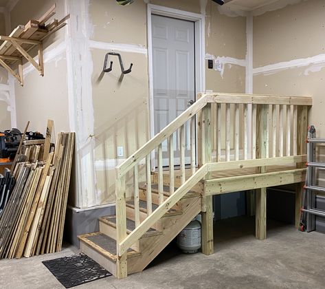 Fashioned using 4x4 treated lumber for posts, 2x and 1x construction lumber for the frame and railing, then deck boards for the platform. Stringers are custom from 2x12’s. Garage Railing Ideas, Garage Stair Storage, Steps Going Into House From Garage, Garage Platform Entry, Garage Stair Railing, Garage Steps Into House With Landing, Garage Landing Ideas, Garage Steps Into House Ideas, Garage Stairs Into House