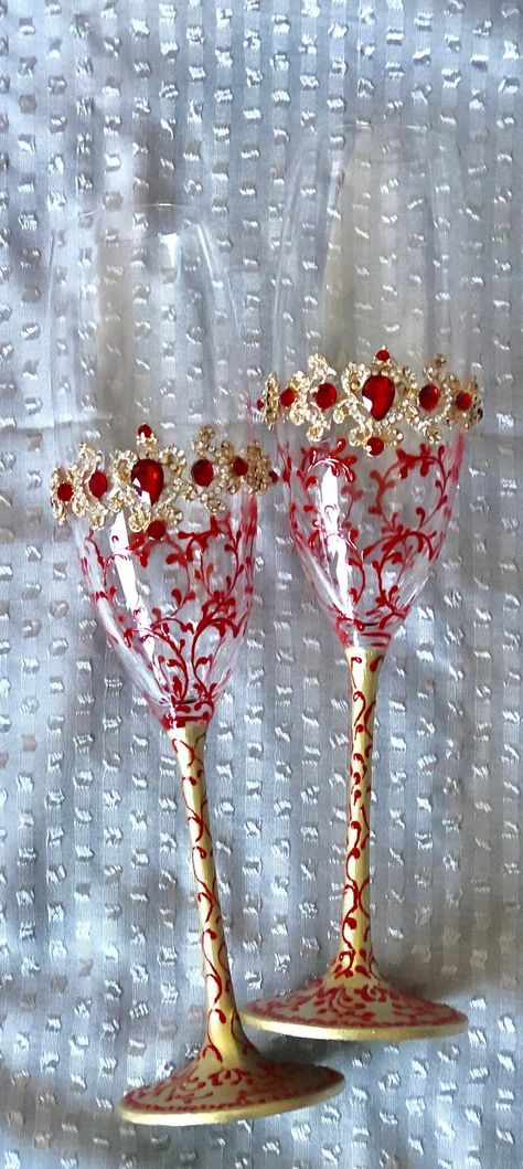 This beautiful red and gold hand painted wedding accessory set includes all you need to celebrate in style your newlywed status. Embellished with jewel-like beads, the set includes toasting flutes, cake server set, and unity candle ceremony set and is also available by individual pieces. Personalized with your names and the date of your wedding this set makes for a cherished heirloom of your special day. Red Gold Cake, Red And Gold Wedding Theme, Red And Gold Quince, Red And Gold Wedding, Gold Quinceanera, Candles Red, Gold Champagne Flutes, Red Gold Wedding, Hand Painted Candle Holders