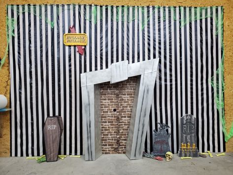 We had a Halloween party and went with the iconic Beetlejuice for inspiration. Beetlejuice Window Display, Beetlejuice Garage Door, Beetlejuice Hallway Decorations, Bettle Juice Party Theme, Beetlejuice Fireplace Diy, Beetlejuice Outdoor Decor, Beetlejuice Photo Booth, Beetlejuice Backdrop Ideas, Beetlejuice Photo Backdrop