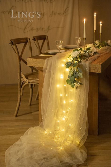 Long Table Bridal Shower Decor, Fairy Lights Under Cheesecloth, Tulle Table Runner With Lights, Fairy Lights Table Runner, Tulle Eucalyptus Table, Square Cocktail Table Wedding, Tulle Decor Ideas, Tule Table Runner, Tulle Ideas Decoration