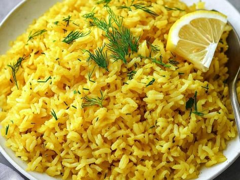 Greek Lemon Rice: A Bright, Flavorful Side Dish for Any Meal - NewsBreak Totchos Recipe, Greek Lemon Rice, Braised Short Ribs Recipe, Pork Tenderloin Sandwich, Homemade Meatloaf, Greek Lemon Chicken, Lemon Potatoes, Lemon Rice, Bacon Pasta