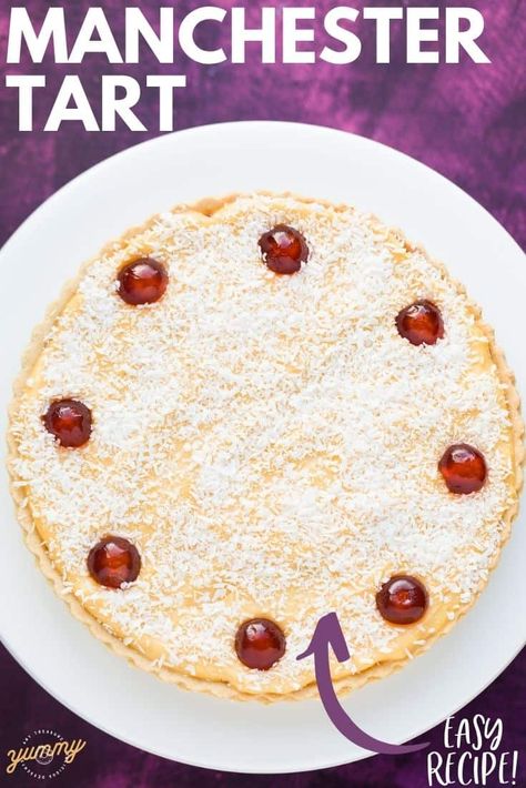 Using a shop bought pastry case makes this Manchester Tart so quick and easy. This old school pud has a layer of raspberry jam, sliced banana and homemade custard. Decorated with dessicated coconut and a cherry on top! Manchester Tart Recipe, School Puddings British, Old School Cake Recipes, Banana Tart Recipe, School Puddings, Old School Puddings, Manchester Tart, School Desserts, Custard Cakes