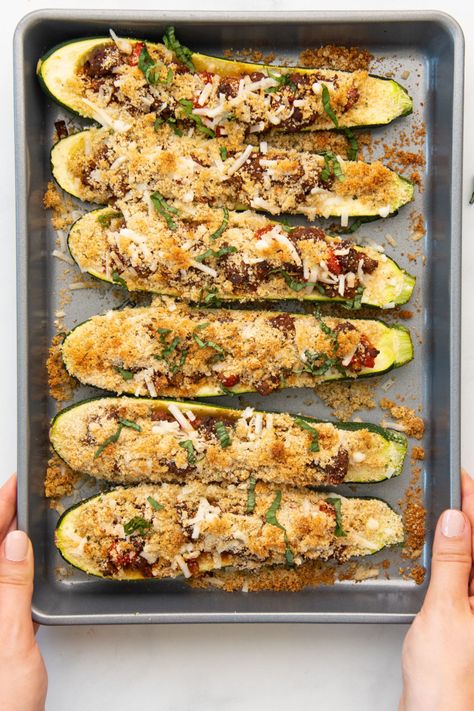 Vegan zucchini boats are a delicious summertime dinner dish. This stuffed zucchini boats recipe is easier to make and healthier than traditional lasagna, but every bite of these beauties is loaded with the classic Italian flavors you love! | mindful avocado Vegan Zucchini Boats, Vegetarian Zucchini Recipes, Zucchini Boats Recipe, Zucchini Boat Recipes, Vegan Risotto, Stuffed Zucchini Boats, Traditional Lasagna, Zucchini Recipe, Vegan Mozzarella