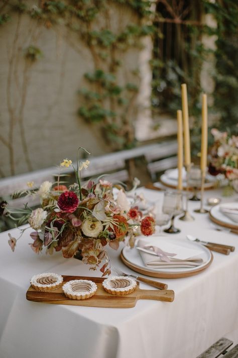 Hang on to your hats, because this earth toned wedding inspiration will have you spinning with ideas. Modern bridal fashion (dare we say… silk jumpsuit?), floral cuffs and a courtyard reception are just a few of the ingredients in this recipe for awesome sauce. And we know you will love every creative detail! #ruffledblog Courtyard Reception, Earth Tone Wedding, Courtyard Wedding, Earthy Wedding, Florist Design, Spring Tablescapes, Fall Florals, Awesome Sauce, Silk Jumpsuit