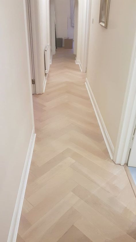 The living room exuded a tranquil and neutral ambiance, thanks to the serene white walls and the harmonious pairing of our Istoria Bespoke Hibiscus Oak engineered wood flooring. The warm tones of Hibiscus flooring truly shone in this setting, enhancing the overall aesthetic of the space. Beautiful final results in the heart of Crouch End. Project: Residential Installation: Jordan Andrews Limited Floor: Istoria Bespoke Hibiscus Specification:Prime Grade Large Format Herringbone 15 x 120 x 600mm Light Wood Parquet Flooring, Light Oak Floors Herringbone, Bleached Parquet Floors, Light Oak Parquet Flooring, Ash Parquet Flooring, Engineered Wood Floors Oak, Wood Parquet Flooring, Herringbone Wood Floor, Cream Walls