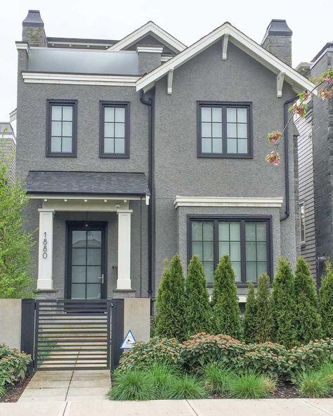 The article says the should paint the window trim to match the cream, but sometimes windows are clad and can't be painted, lady. I like this look. Grey Exterior House Colors, Fasad Design, Gray House Exterior, Best Exterior Paint, Dark Trim, House Paint Color Combination, Gray House, Color Combinations Paint, Exterior House Paint Color Combinations