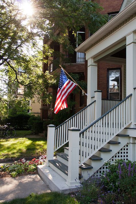 US Flag on the front porch Front Porch American Flag, Us Flag Aesthetic, Us Flag Pictures, Us Flag Wallpaper, United States Aesthetic, America House, Welcome To Usa, House In America, American Flag Pictures